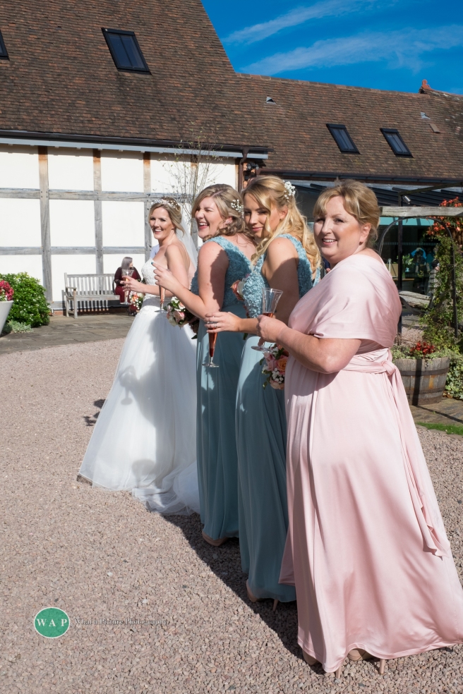 bride and bridesmaids by What a Picture Photography